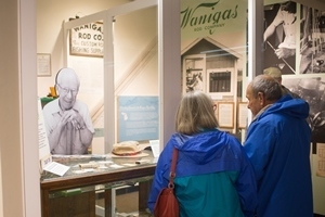 museum visitors look at reproduction of Wanigas Rod Shop