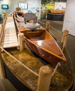 flat-bottomed river boat in museum exhibit