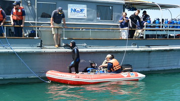 A group of researchers gets ready to dive