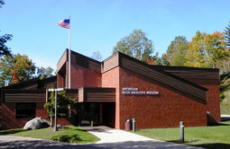 The exterior of the Michigan Iron Industry Museum in the summer