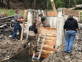 DNR staff working on draw down infrastructure at Hoister Lake