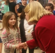 SOS shaking hands with kids