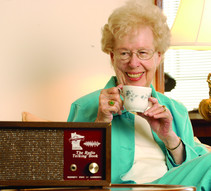 Woman in front of Radio Talking Book receiver