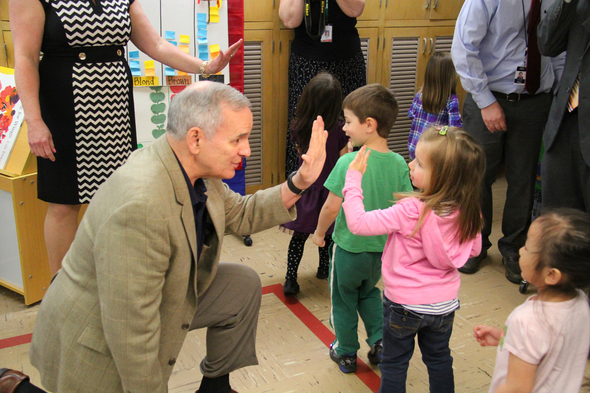 Gov. Dayton "high-fives" a student