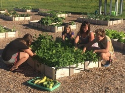 Keri in the garden with students