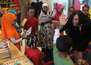 Commissioner Cassellius Shares High Fives with Head Start Students