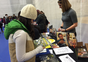 Students visit booths during college fair at Concordia University in St. Paul