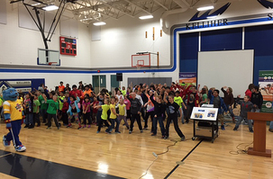 Power Panther leads Kelliher Elementary students in a schoolwide dance-off