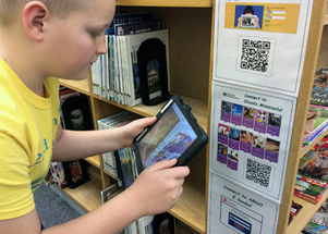 Young Litchfield library patron downloads an ebook from new Minnesota collection