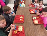 the students eating cherry tomatos
