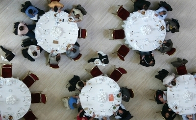 Large round tables with people
