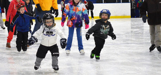Young boys ice skating