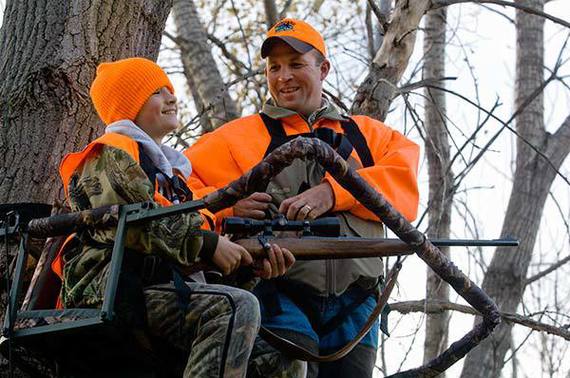 Father and son in a tree stand