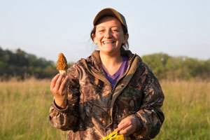 Girl holding a morel.