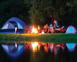 Family camping by lake