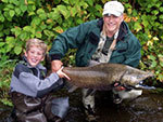 A father and son with their salmon catch.