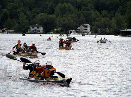 Canoes racing in the Regatta.