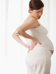 Pregnant woman experiencing back pain