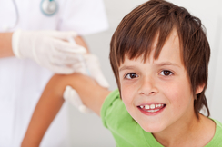 Smiling boy receiving vaccine 