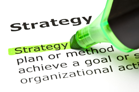 The word Strategy highlighted in green with felt tip marker