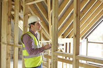 inspector looking at building ceiling