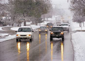 Vehicles with headlights turned on - winter driving