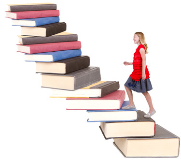 Photo of a girl climbing a flight of stairs made of books.