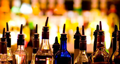 Photograph of liquor bottles in a line