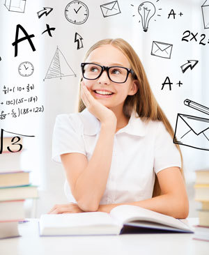 Photo of a girl daydreaming at a desk with a book