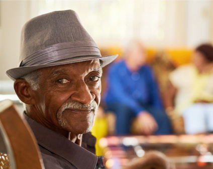 Image of an older Texan in a clinic, waiting for services.