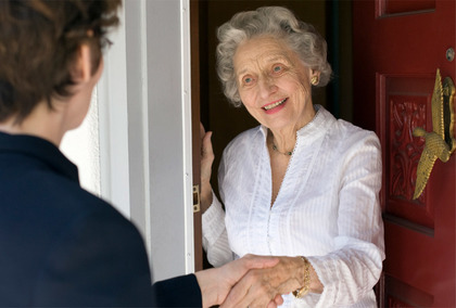 Photo of APS worker visiting older Texan