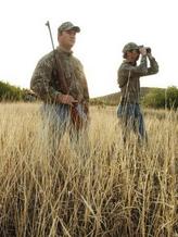 two hunters in field
