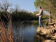 man fishing in brush