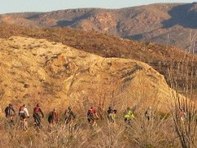 biking group on desert trail