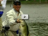 happy angler holding big bass