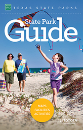 State Park Guide cover - girl with kite on beach