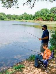man and son bank fishing