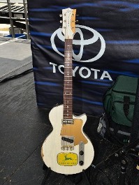 Guitar leaning against Toyota logo