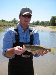 Tim Birdsong in river with bass