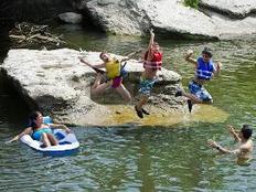 family swimming, kids jumping into water