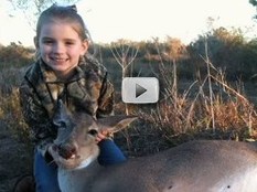 young girl with bagged deer