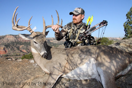 Bowhunter with deer