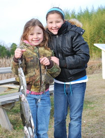 Girls with rainbow trout