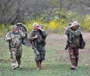 3 turkey hunters with birds