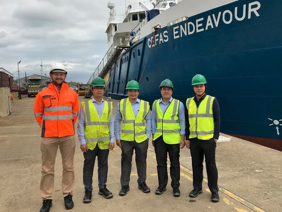 Members of the Vietnam Research Institute for Marine Fisheries (RIMF) in front of Cefas’s RV Endeavour on a recent visit to the UK. 