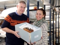 Curator of Ethnography Tony Eccles and researcher Kristin Leith with the donated skull.