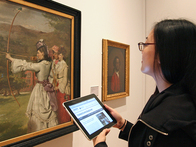 Visitor using free wifi to leave comments on RAMM’s Collections Explorer while in the galleries