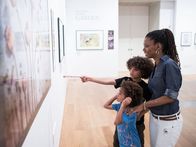Family visiting International Garden Photographer of the Year exhibition