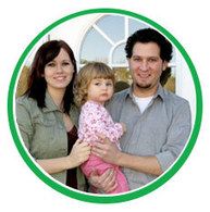 Happy family outside their home