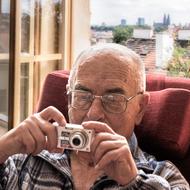 old person with camera